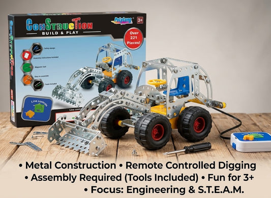 A metal construction toy set shown with its retail box on a tabletop. The set includes a silver excavator-style digging vehicle with black wheels and red wheel hubs, loose metal parts, a small remote control, and accessories.