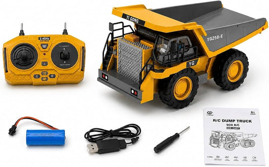 Yellow 2.4GHz remote control dump truck toy with controller, rechargeable battery, USB charging cable, screwdriver and instruction manual