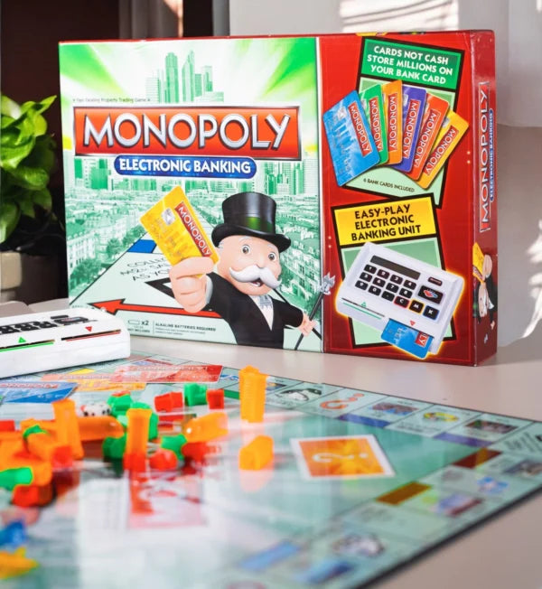 Monopoly Electronic Banking board game set with packaging in the background